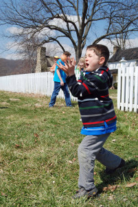 kid participating in pass the egg activity